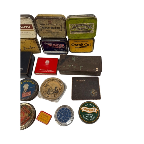 31 - A group of vintage advertising tins, mainly tobacco related.