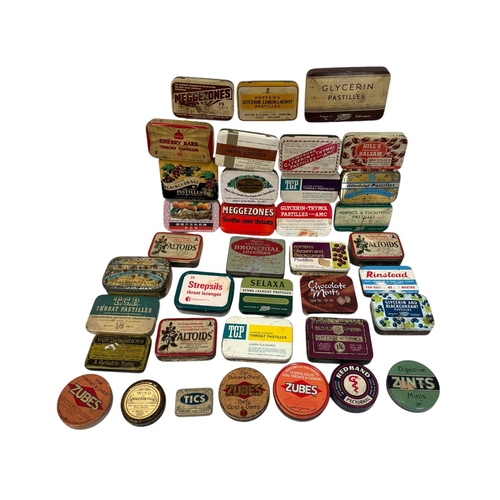 32 - A quantity of vintage advertising tins, mainly throat lozenges.