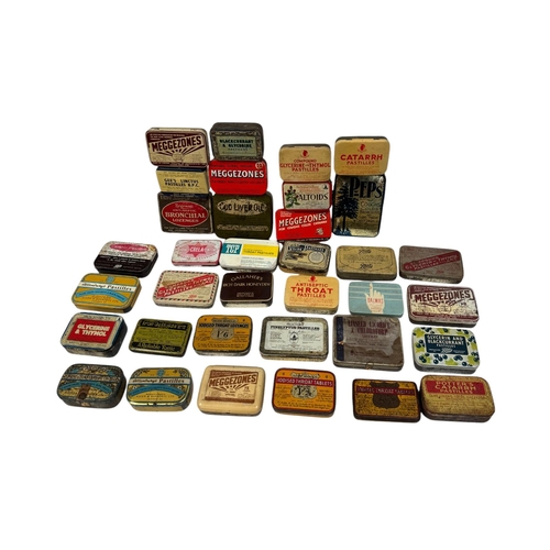 32 - A quantity of vintage advertising tins, mainly throat lozenges.