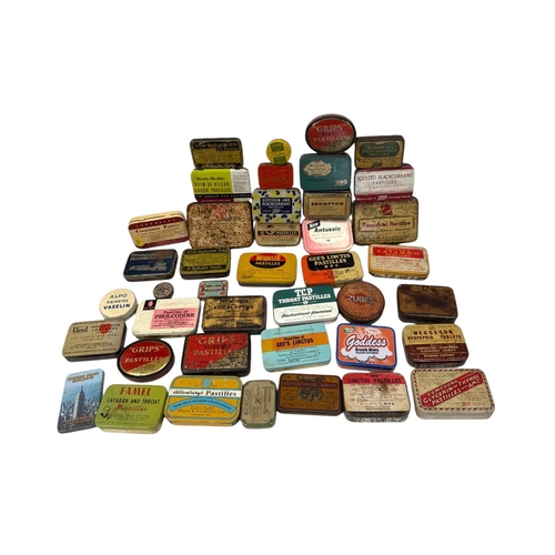 32 - A quantity of vintage advertising tins, mainly throat lozenges.