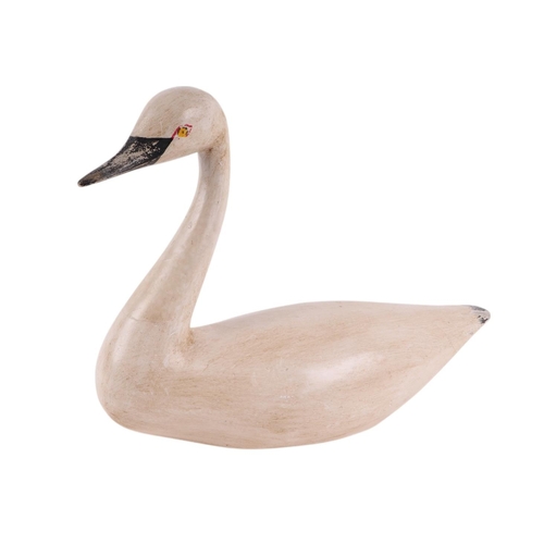 453 - A contemporary painted model of a swan, 28cms wide.