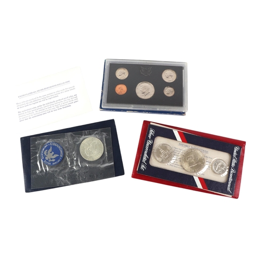 458 - US silver proof and uncirculated coin sets including two 1984 silver dollars and 1989 2-coin proof s... 