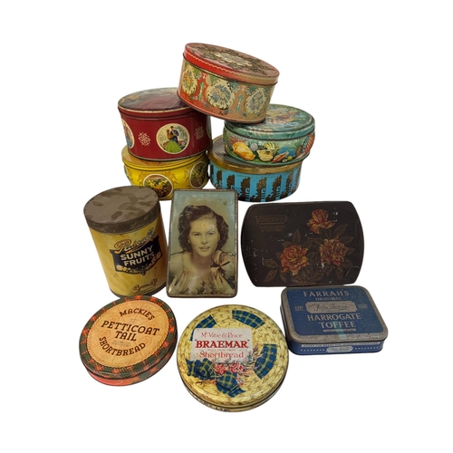 49 - A quantity of vintage advertising tins, mainly toffees and biscuit tins.