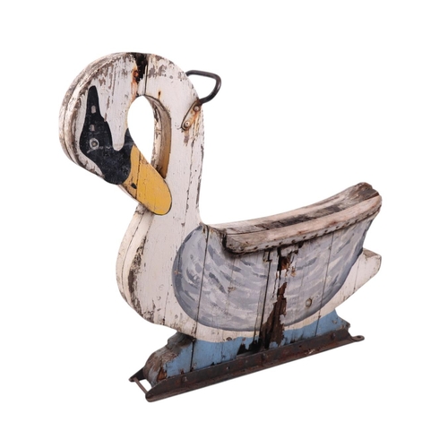 917 - Folk Art.  A carved and painted wooden swan fairground ride, approx 103cms long.