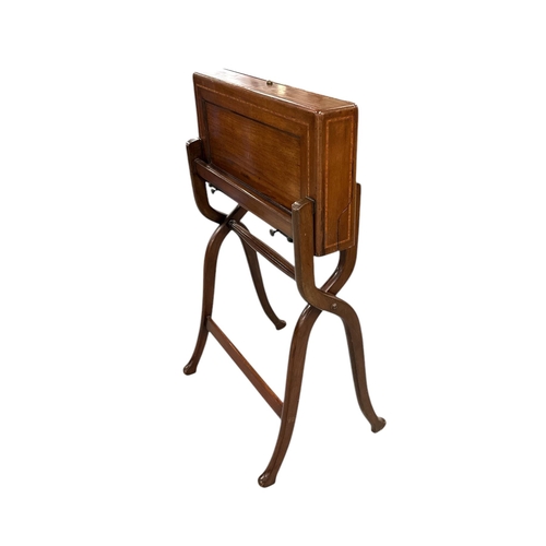 1013 - Military interest.  A late 19th century mahogany folding Campaign desk 'Best London Make', with fitt... 