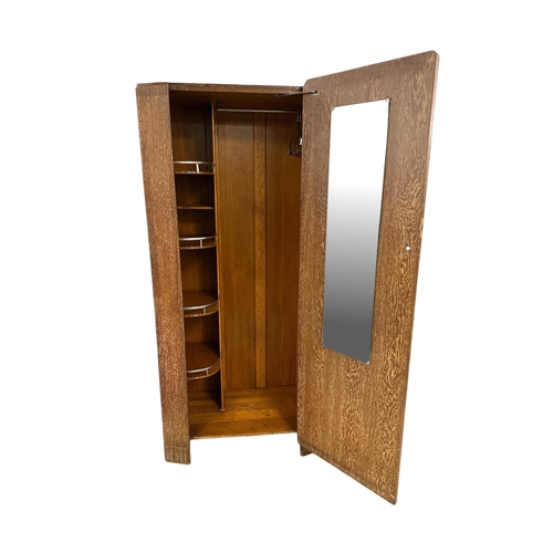 1020 - An Art Deco limed oak gentleman's single wardrobe in the manner of Heals, with fitted interior, 86cm... 