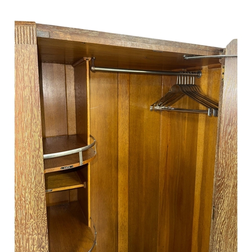 1020 - An Art Deco limed oak gentleman's single wardrobe in the manner of Heals, with fitted interior, 86cm... 