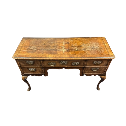 1023 - A 19th century Charles II style walnut sideboard, the crossbanded and quarter veneered top above an ... 