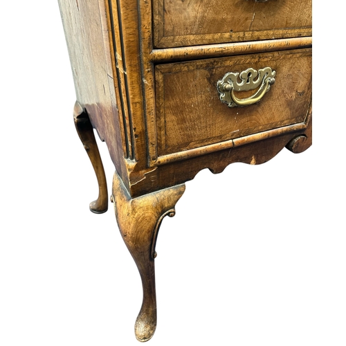 1023 - A 19th century Charles II style walnut sideboard, the crossbanded and quarter veneered top above an ... 