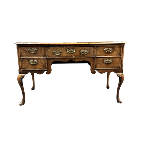 1023 - A 19th century Charles II style walnut sideboard, the crossbanded and quarter veneered top above an ... 