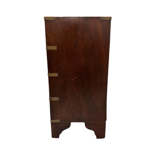 1025 - A Campaign style small chest with an arrangement of four drawers, on bracket feet, 46cms wide.Condit... 