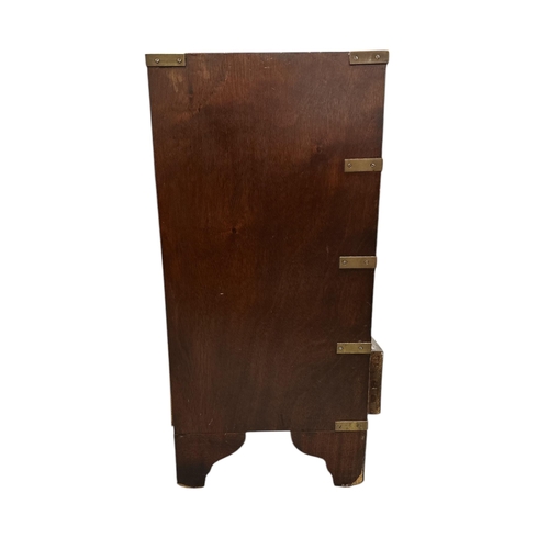 1025 - A Campaign style small chest with an arrangement of four drawers, on bracket feet, 46cms wide.Condit... 