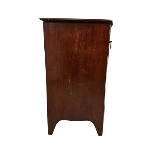 1046 - A 19th century bowfronted mahogany commode cupboard (later converted to a bedside cupboard), 62cms w... 