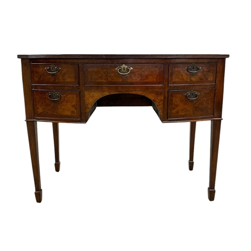 1062 - A 19th century bowfronted figured walnut sideboard with an arrangement of five drawers, on square ta... 