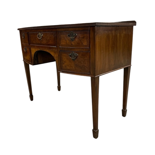 1062 - A 19th century bowfronted figured walnut sideboard with an arrangement of five drawers, on square ta... 