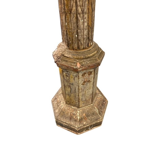 1067 - A tall giltwood column or torchere with scrolling vine decoration, 180cms high.