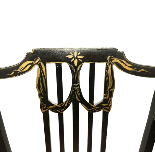 1068 - A pair of Regency style ebonised and gilt elbow chairs with upholstered seats (2).