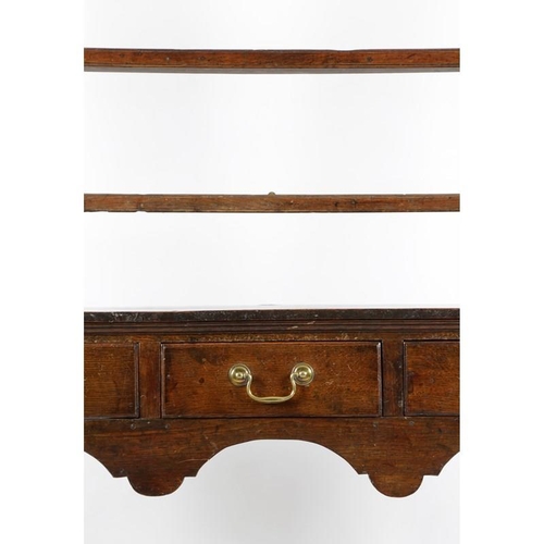 1078 - An oak dresser, 18th century elements and later, the raised plate rack with two shelves above three ... 