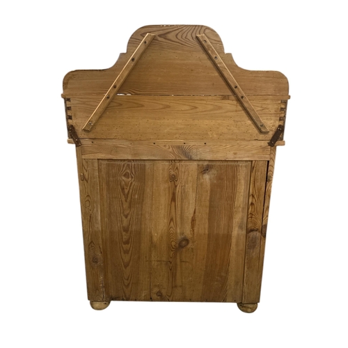 1081 - A continantal pine side cabinet, the single drawer above a field panelled door enclosing a shelved i... 