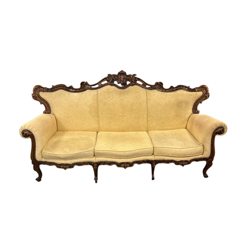 1090 - A continental carved walnut and upholstered three-piece suite in the French taste, each piece with s... 