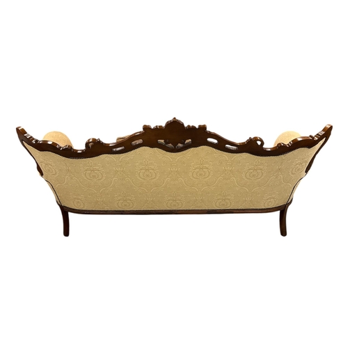 1090 - A continental carved walnut and upholstered three-piece suite in the French taste, each piece with s... 