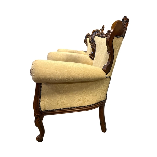 1090 - A continental carved walnut and upholstered three-piece suite in the French taste, each piece with s... 