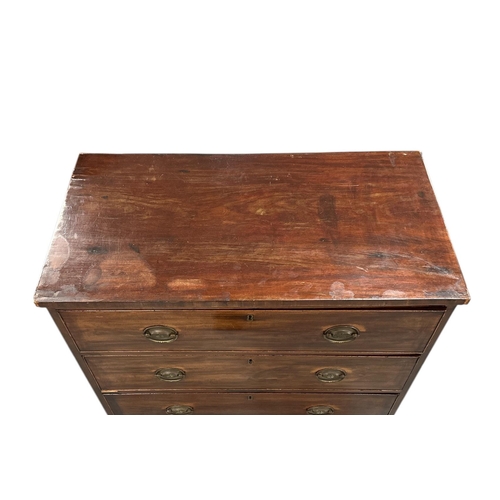 1114 - An early 19th century mahogany chest of three graduated long drawers, on splayed bracket feet, 91cms... 