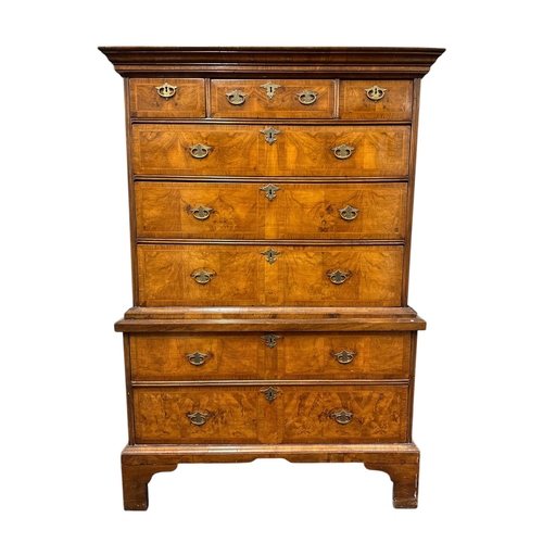 1117 - A George III walnut and crossbanded chest-on-chest, the upper section with a moulded cornice above t... 