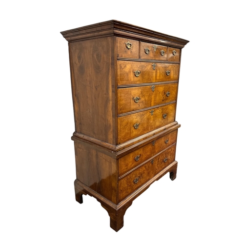 1117 - A George III walnut and crossbanded chest-on-chest, the upper section with a moulded cornice above t... 