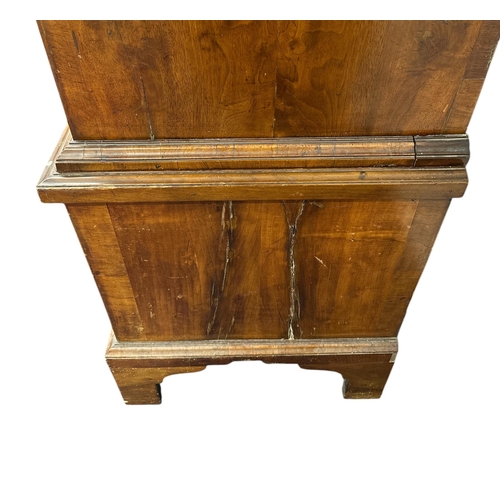 1117 - A George III walnut and crossbanded chest-on-chest, the upper section with a moulded cornice above t... 