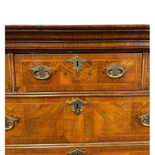 1117 - A George III walnut and crossbanded chest-on-chest, the upper section with a moulded cornice above t... 