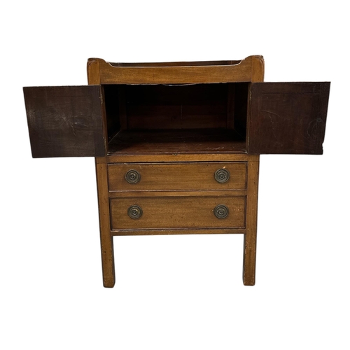 1120 - A 19th century mahogany tray-top bedside, the pair of cupboard doors above two drawers, on square ch... 