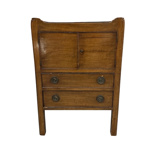 1120 - A 19th century mahogany tray-top bedside, the pair of cupboard doors above two drawers, on square ch... 