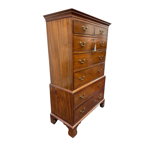 1123 - A 19th century mahogany chest-on-chest with two short and five graduated long drawers, on bracket fe... 