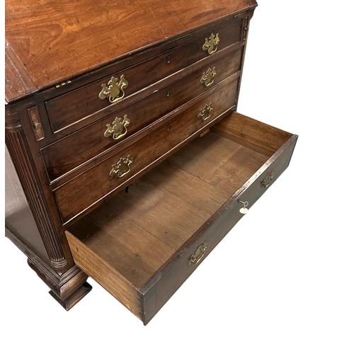 1128 - A 19th century mahogany bureau, the fall-flap enclosing a fitted interior with secret compartments, ... 