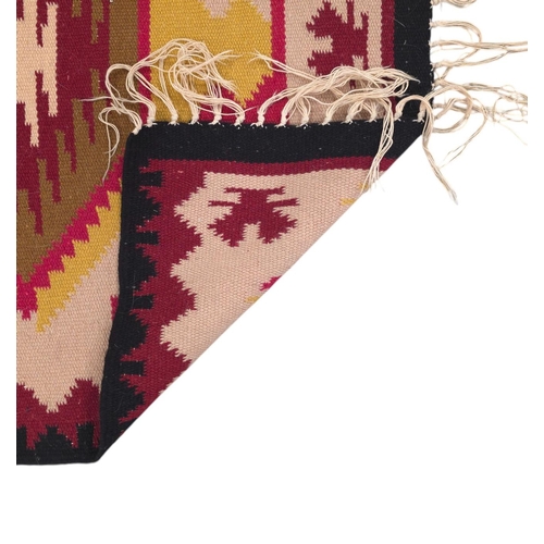 148 - A small kilim rug, 65cms by 132cms.