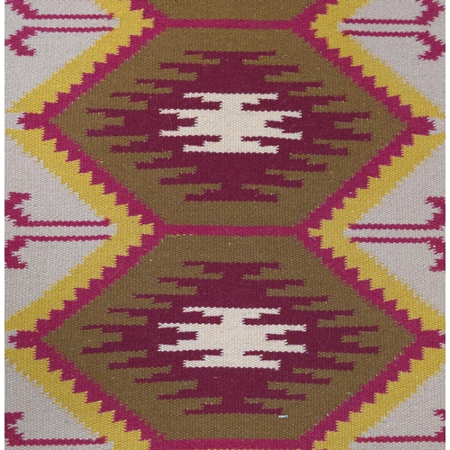 148 - A small kilim rug, 65cms by 132cms.