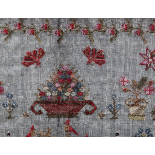 158 - A George III sampler by Ann Radford Dickinson, dated 1816, worked in colours with vases of flowers a... 