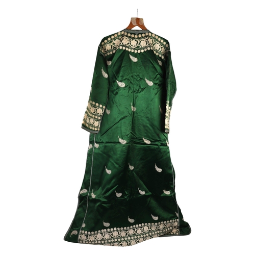 164 - A Moroccan embroidered kaftan decorated with foliate scrolls on a green ground.