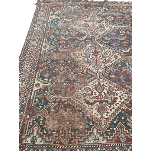 169 - A Persian Heriz woollen hand knotted rug, 150 by 195cms.