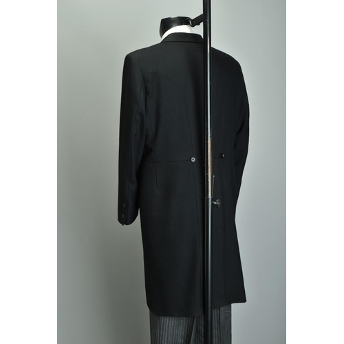 216 - Morning Dress.  A large gentleman's tailcoat waistcoat & striped trousers (ref: XFP).