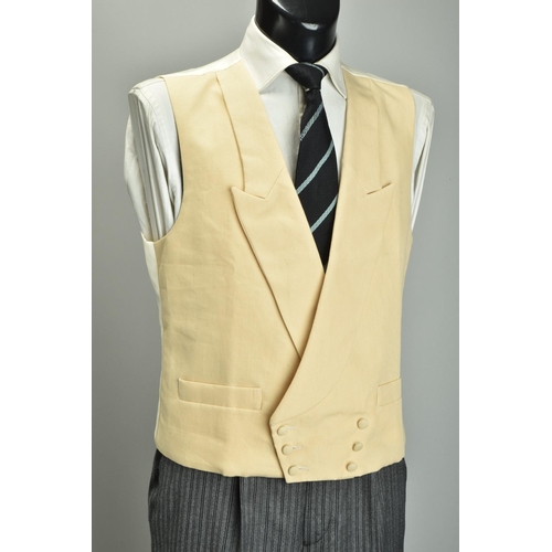 216 - Morning Dress.  A large gentleman's tailcoat waistcoat & striped trousers (ref: XFP).