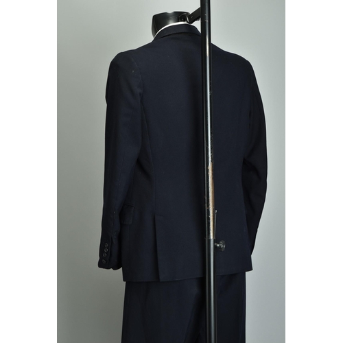 219 - A Gieves 1959 Suit. Demob style navy blue two-piece with peak lapels (ref JRQ).