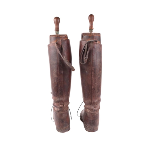 32 - A pair of WWI Officer's leather riding boots, both with wooden trees by Peal & Co, London, overall 5... 