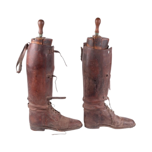 32 - A pair of WWI Officer's leather riding boots, both with wooden trees by Peal & Co, London, overall 5... 