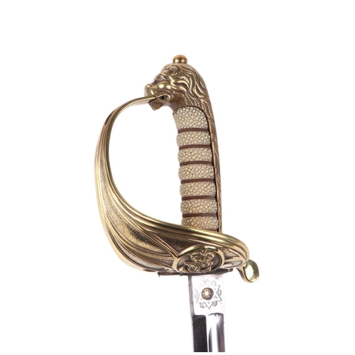 34 - A Royal Marine naval dress sword with shagreen brass hilt and lion head terminal, 95cms long.