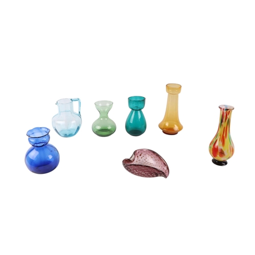 385 - A quantity of coloured glass to include Hyacinth vases, decanters and jugs.