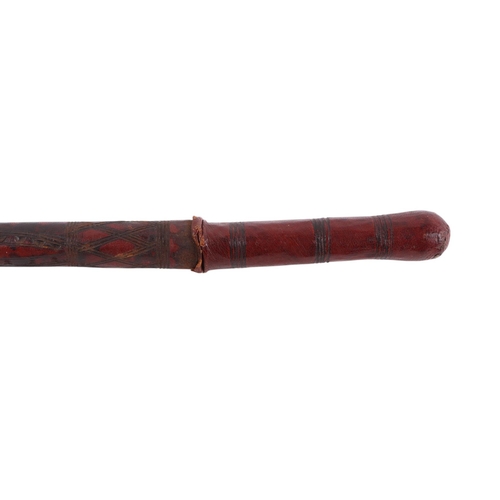 40 - A Middle Eastern leather covered swagger sword stick, overall 61cms long, the blade length 39cms.