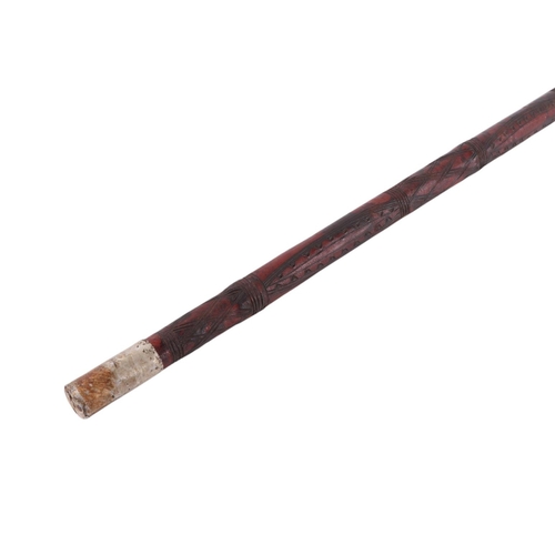 40 - A Middle Eastern leather covered swagger sword stick, overall 61cms long, the blade length 39cms.