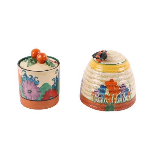 400 - A Clarice Cliff Crocus pattern Bizarre beehive honeypot and cover, 9cms high; together with a Claric... 